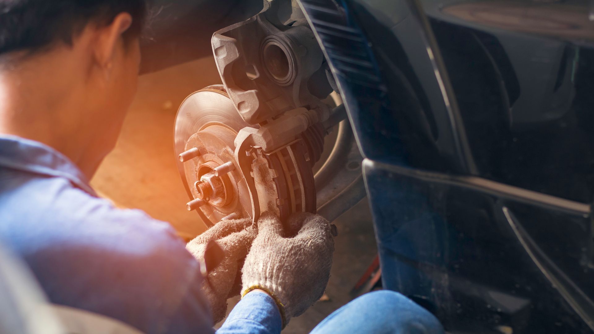 Close up of a mechanic fixing a car
