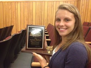 Stephanie Tamburro 2012 Parisi Speed School Scholarship recipient holding award plaque