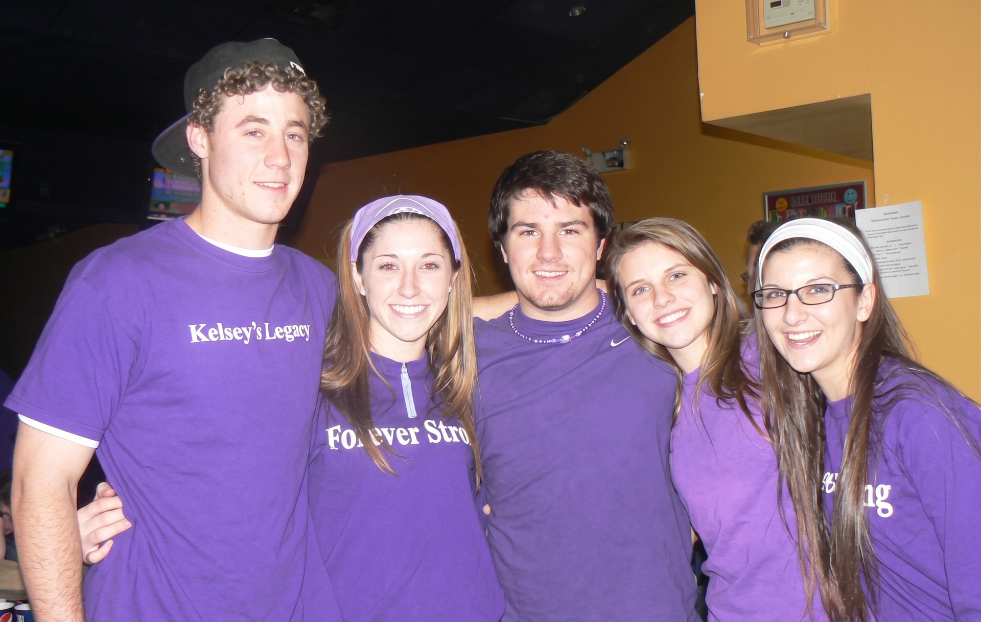 Placeholder image Volunteers wearing Kelsey's Legacy Forever Strong Foundation purple shirts at a foundation event