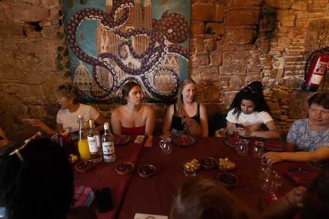 A Barcelona restaurant interior with an octopus mural