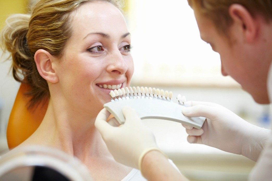 Benefits of Cosmetic Dentistry | Dentist Matching Tooth Shade for Patient