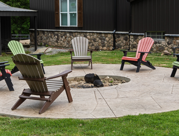 in ground out door stone firepit in a residential backyard