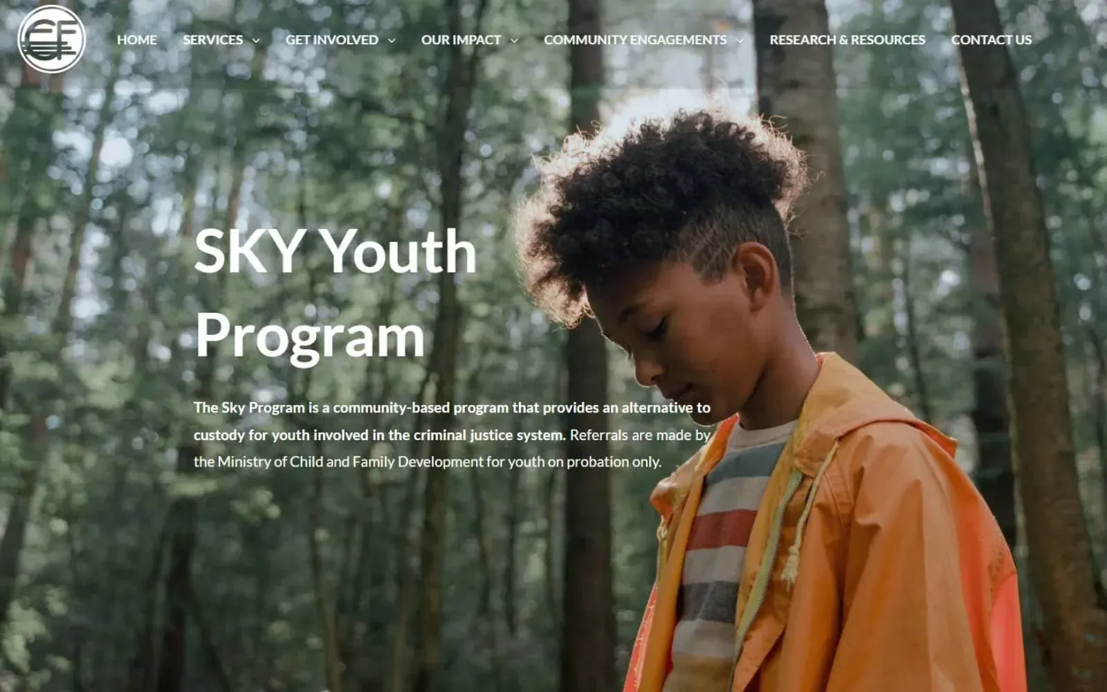 Custom website design example of a youth program page hero with full-bleed outdoor photography and program title