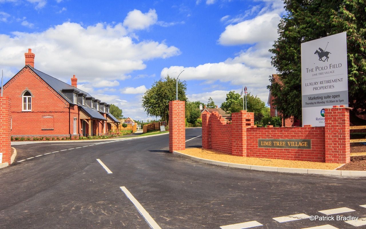 Limetree Village, a sign on a brick wall says the hill plan