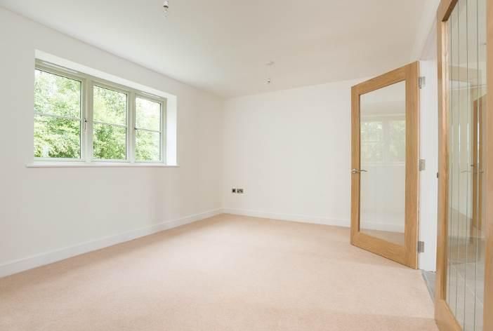 Brailes, An empty room with a window and a door.