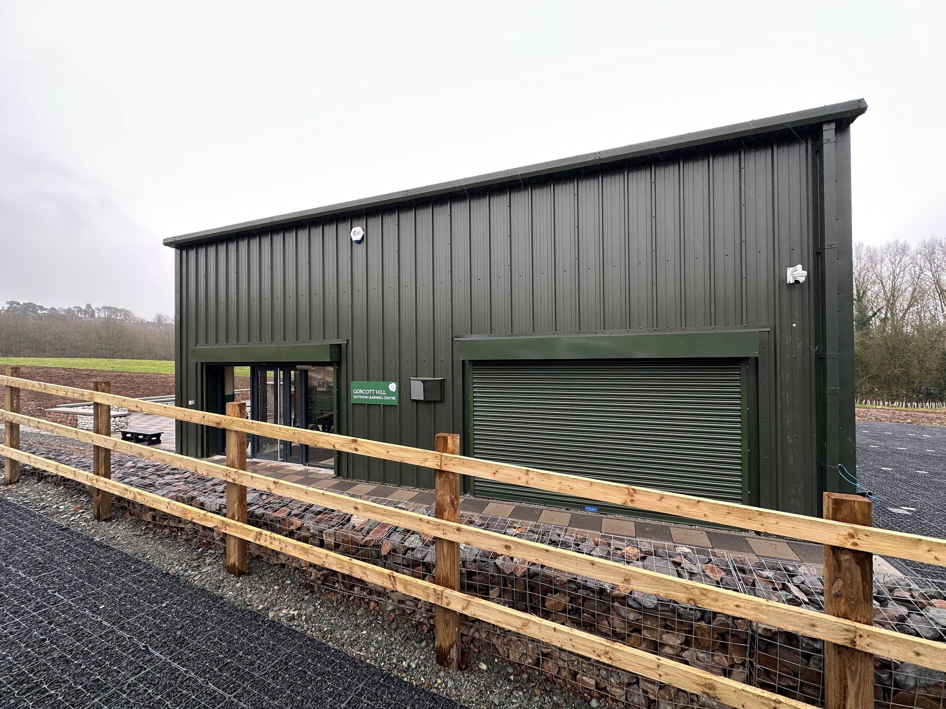 Gorcott Hill, A green building with a wooden fence around it.