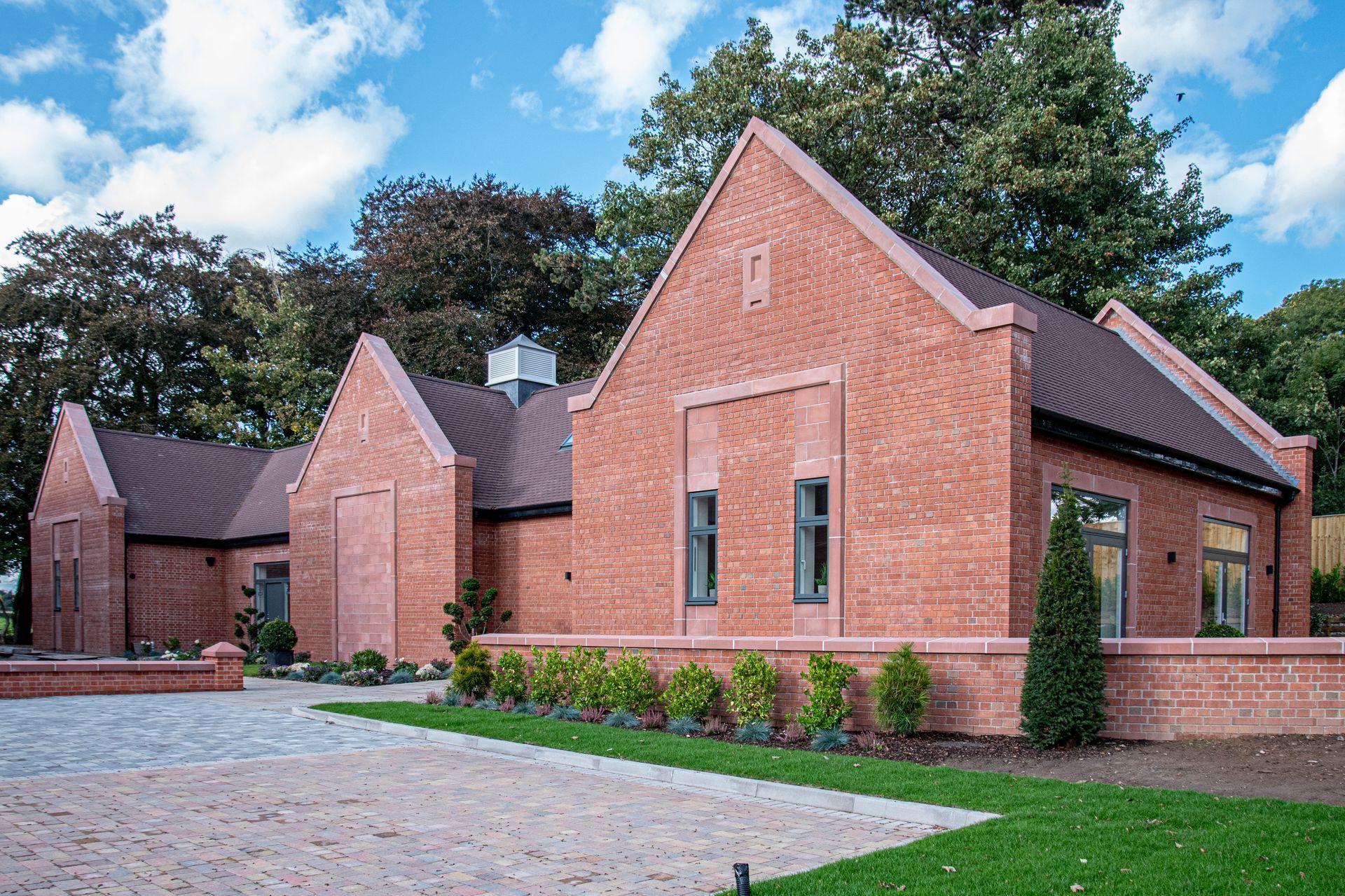 Milverton Hall, a large red brick house with a driveway in front of it