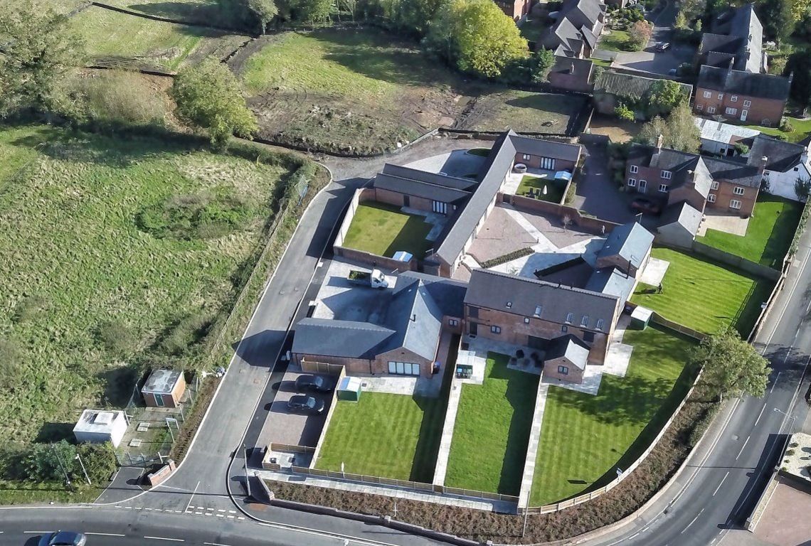 Newbold Farm,  An aerial view of a residential area with lots of houses and gardens
