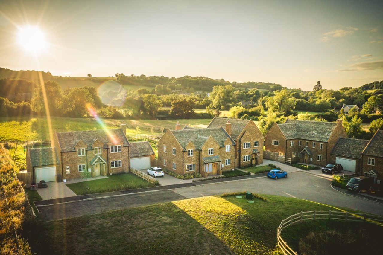 Brailes, An aerial view of a residential area with a lot of houses and trees.