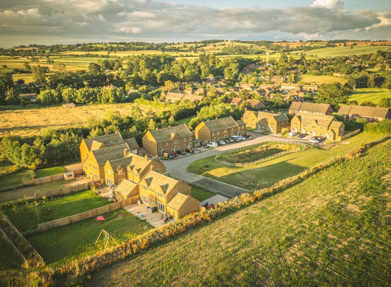 Brailes, An aerial view of a residential area surrounded by fields and trees.