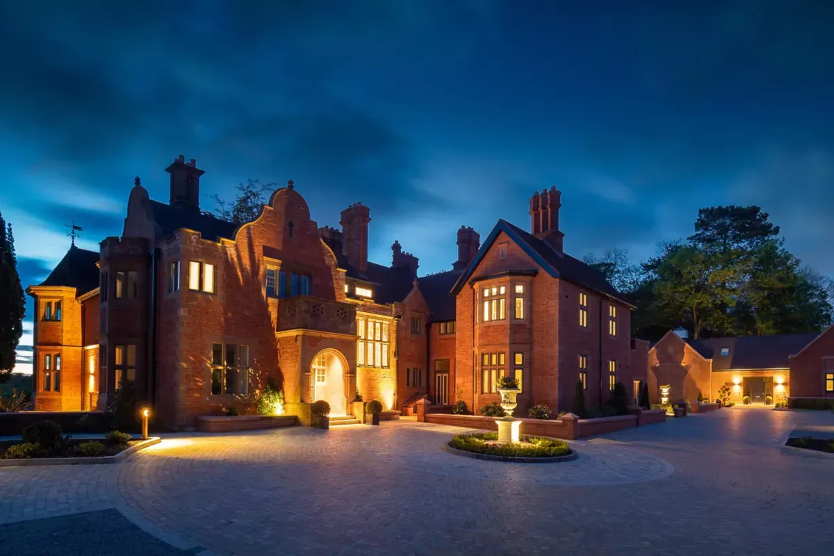 Milverton Hall, A large brick building is lit up at night.