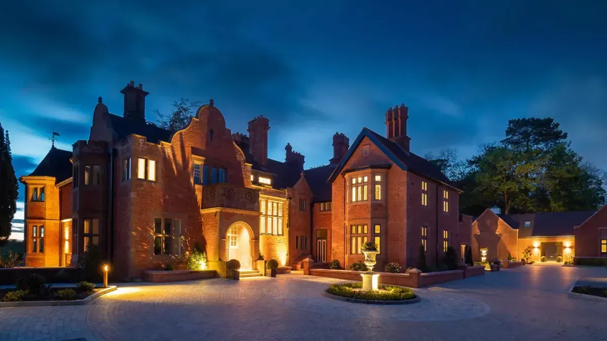 Milverton Hall, A large brick building is lit up at night.