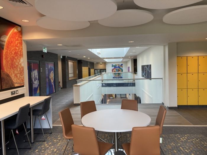 Princethorpe College, There is a table and chairs in the middle of the room.