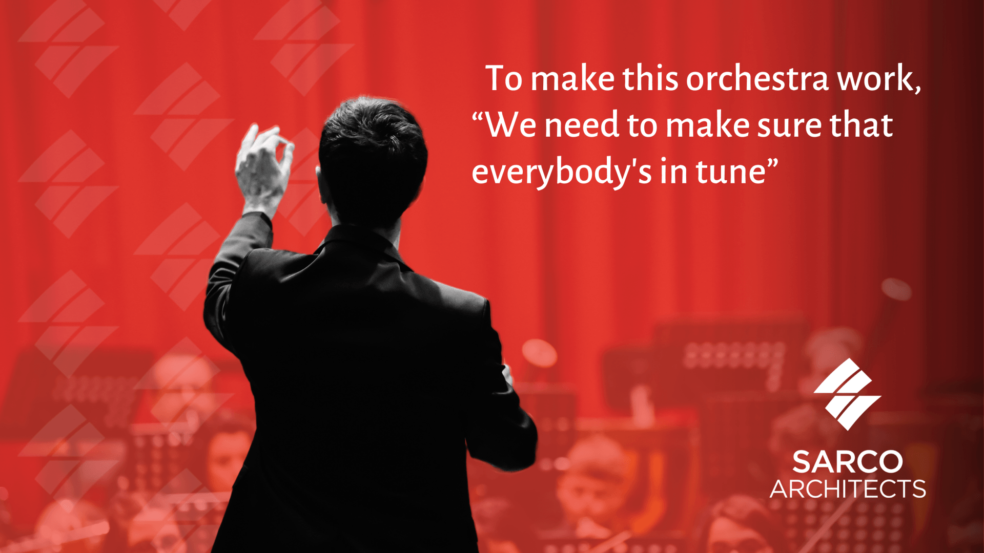 a man stands in front of an orchestra and says