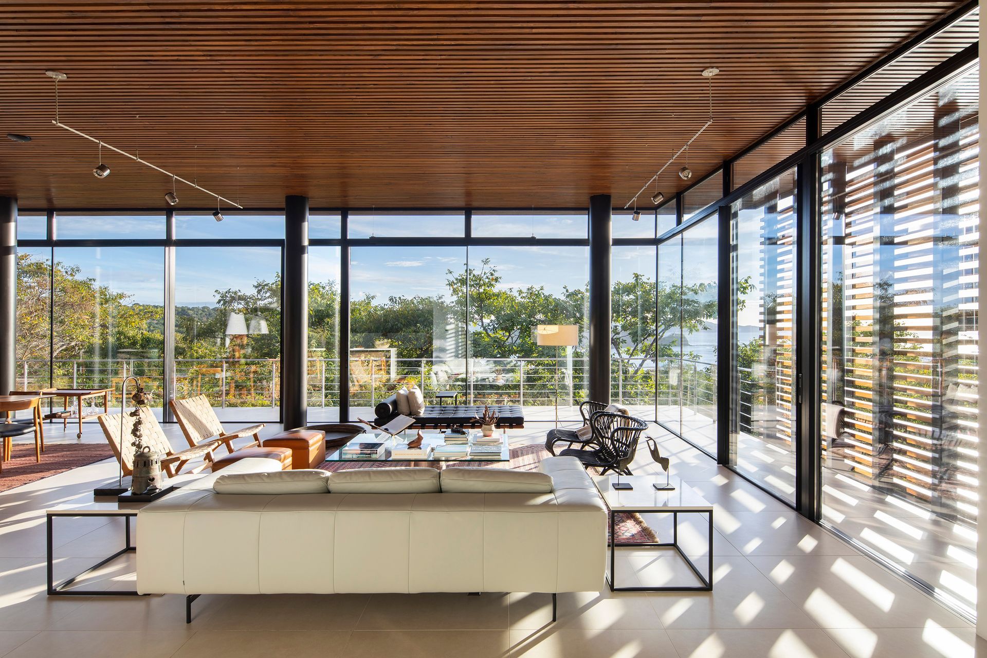 a living room with a lot of windows and a couch .