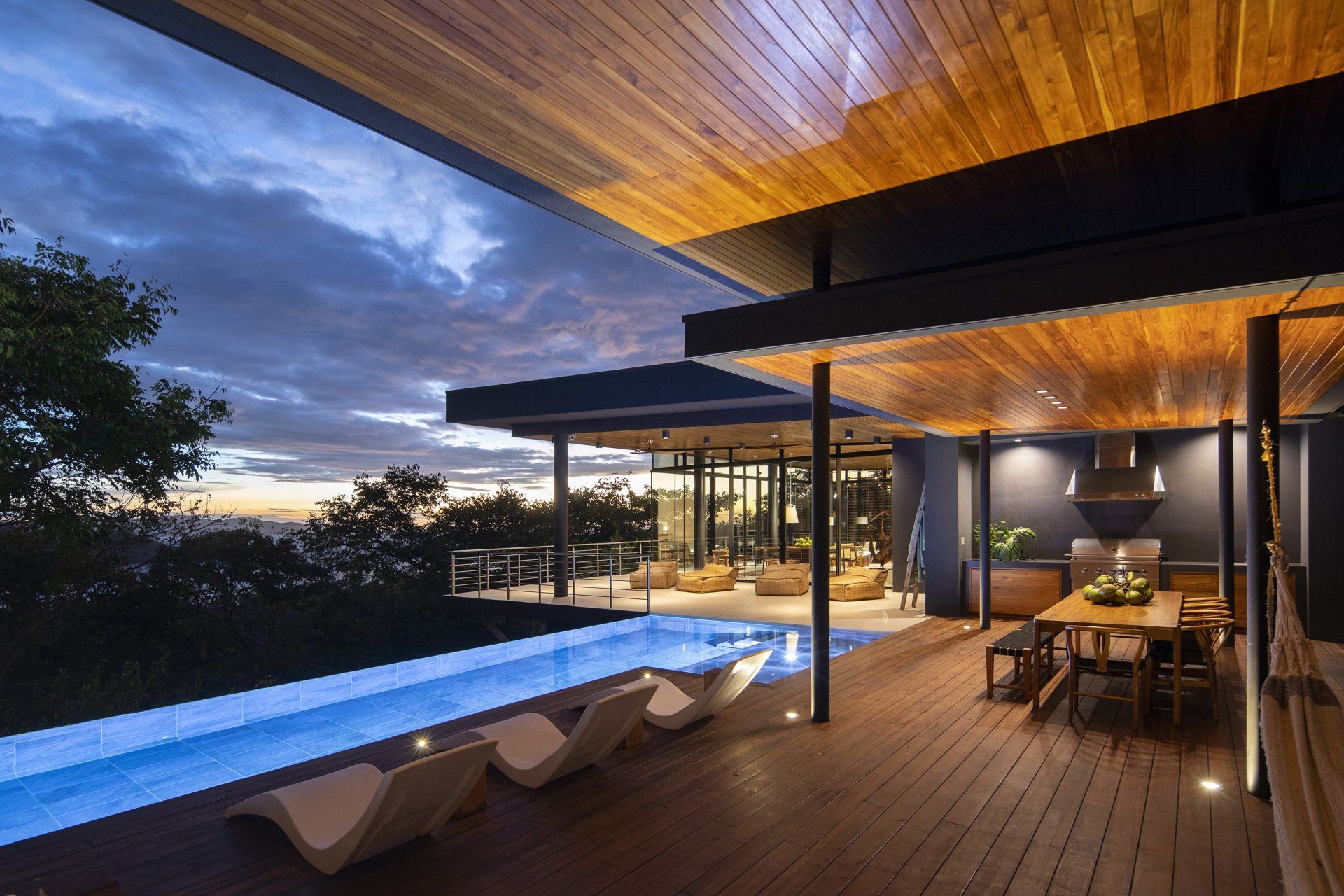 a house with a swimming pool and a wooden deck casa aramara by sarco
