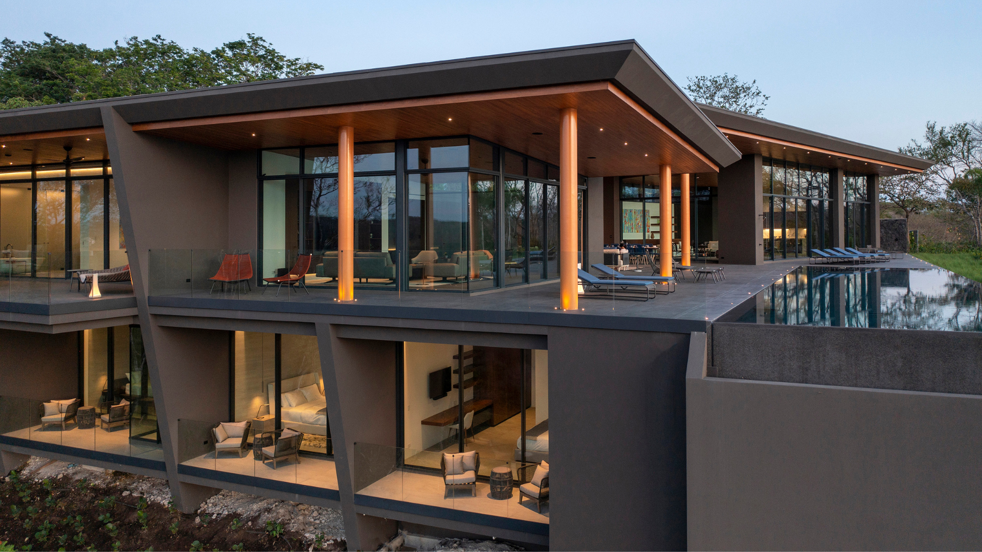 A large house with a swimming pool in the middle of it.