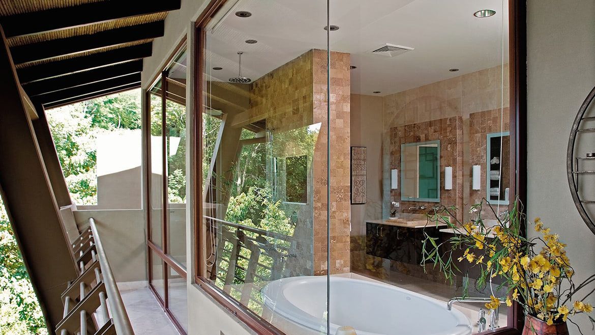 a bathroom with a bathtub and a large window
