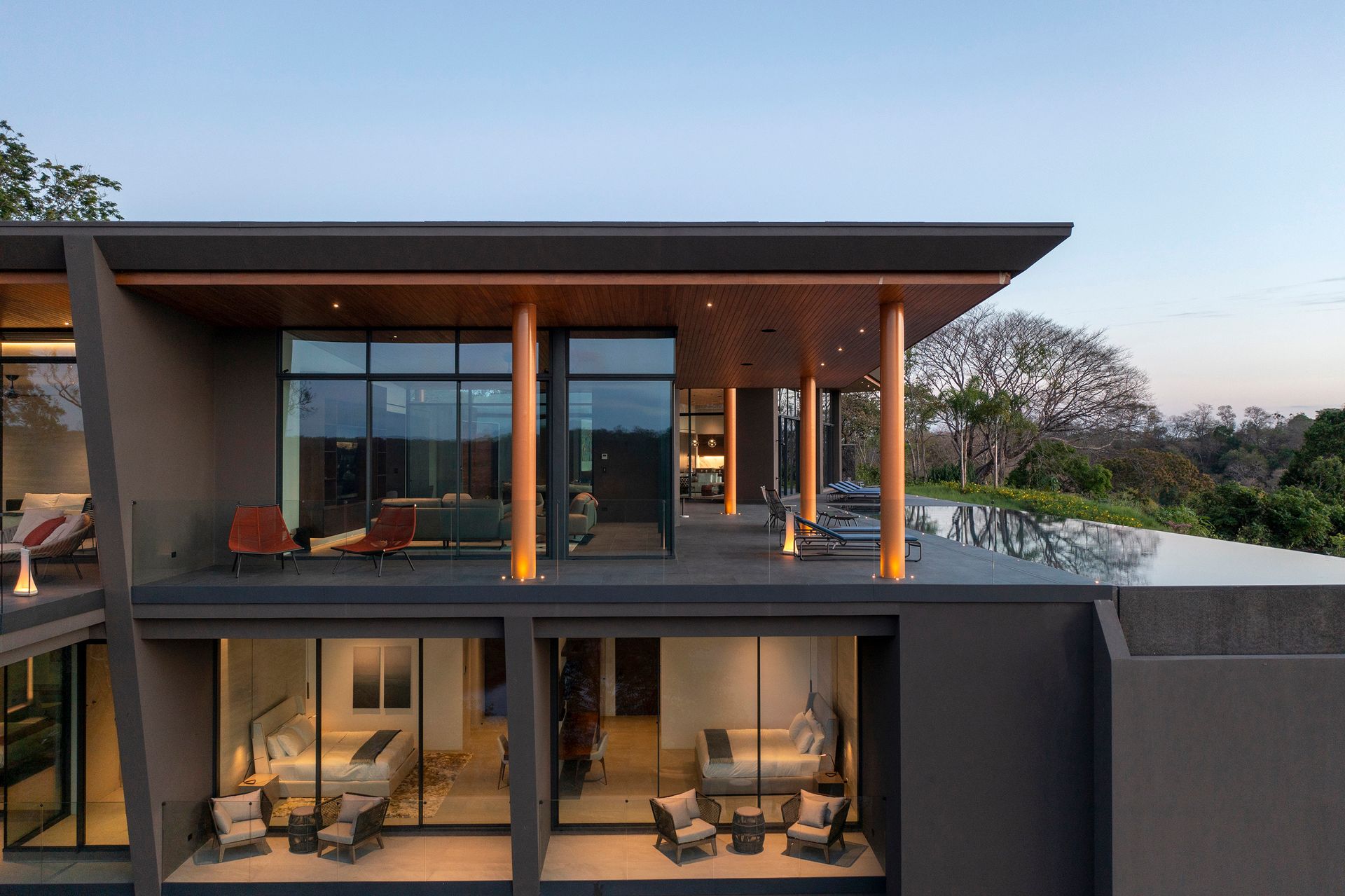 a large house with a lot of windows and a swimming pool .