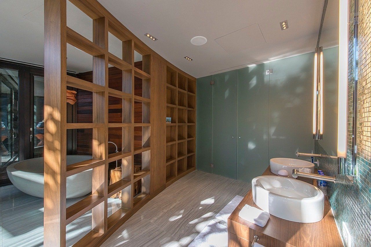 a bathroom with two sinks and a bathtub .