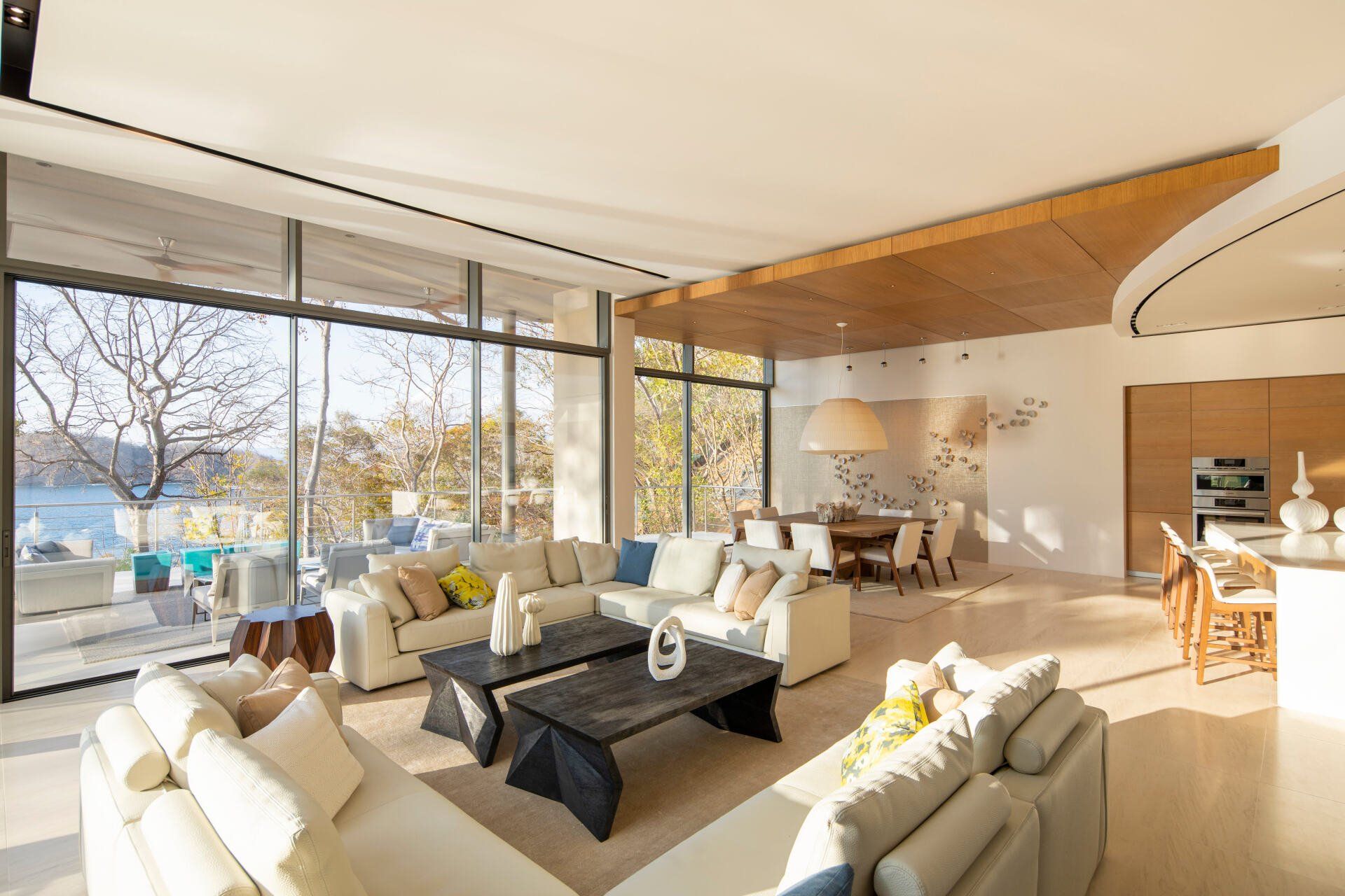 a living room with a lot of furniture and a lot of windows .
