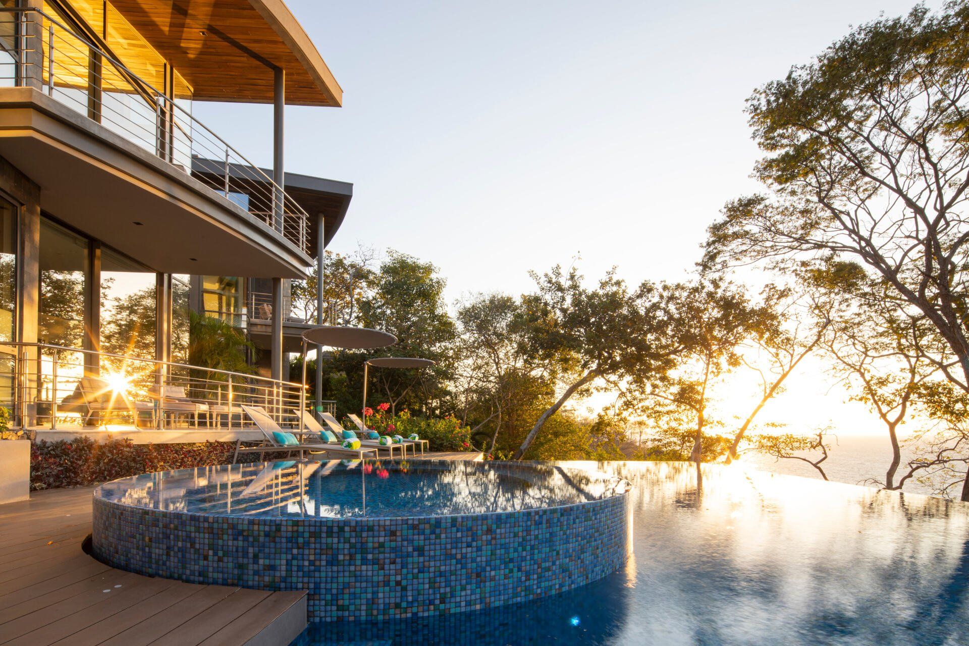 a large house with a swimming pool in front of it