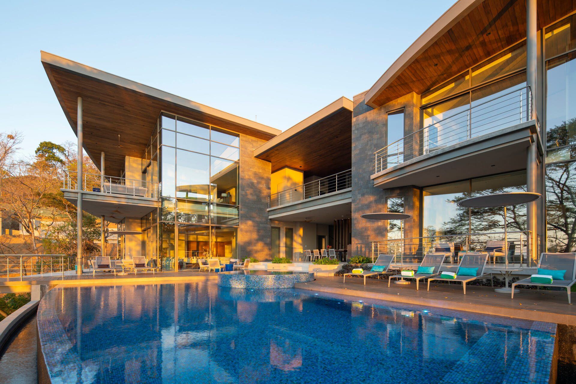 a large house with a large swimming pool in front of it .