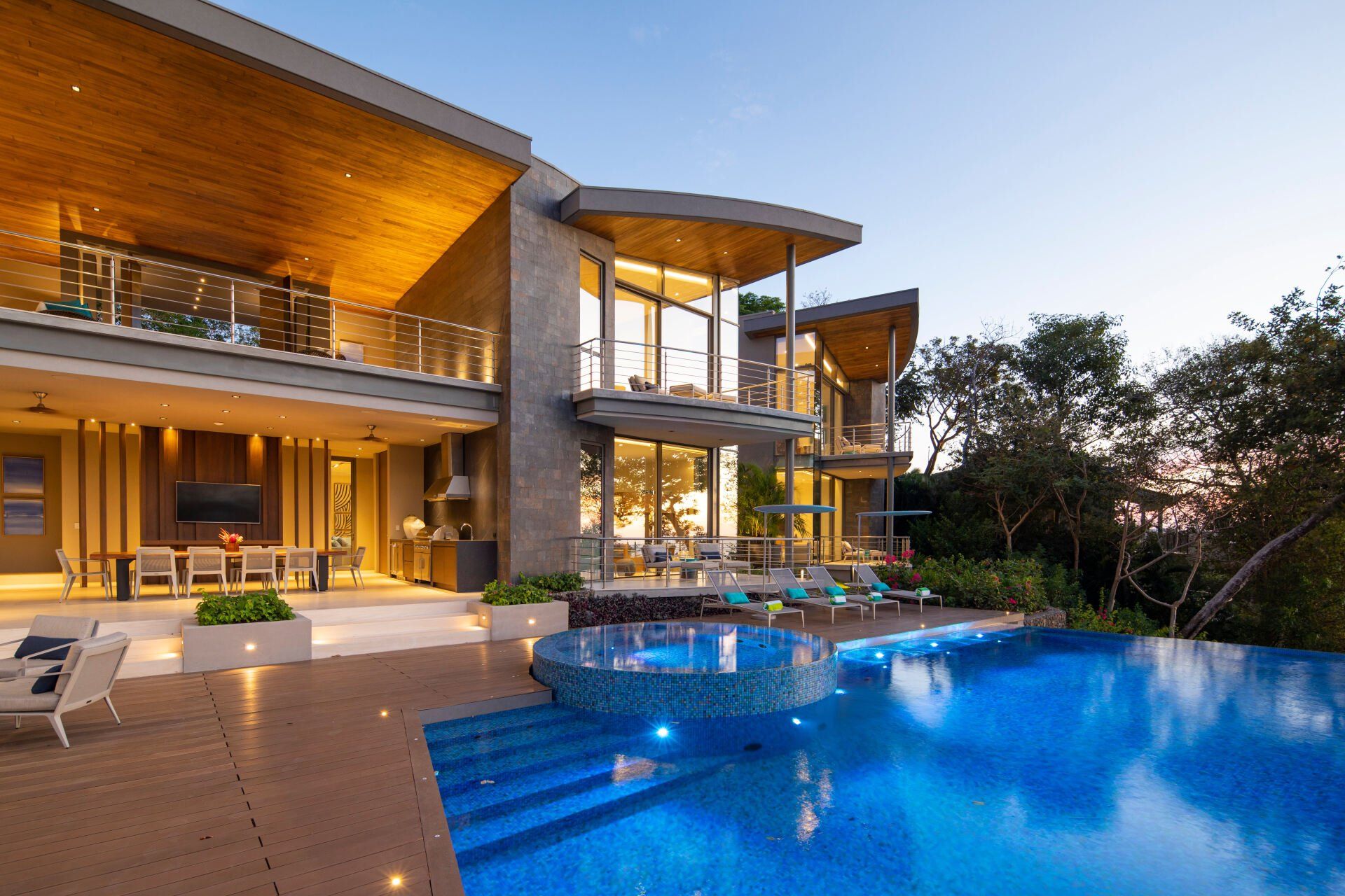 a large house with a swimming pool in front of it
