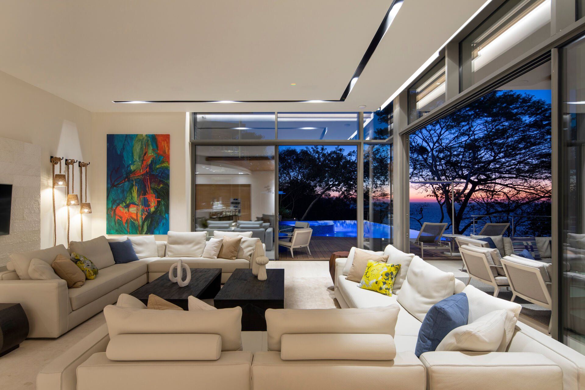 a living room with a lot of furniture and a large window .