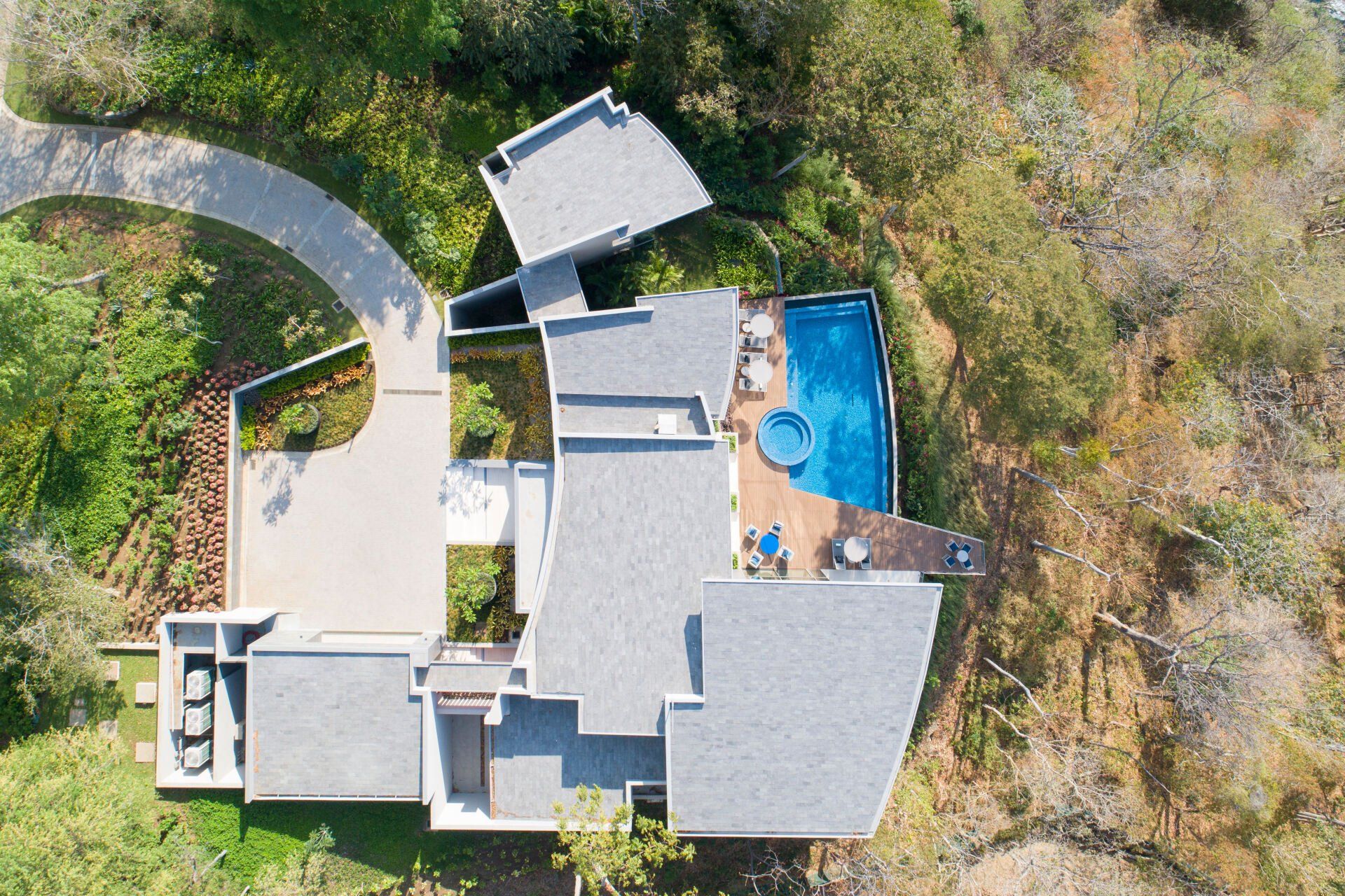 an aerial view of a house with a swimming pool
