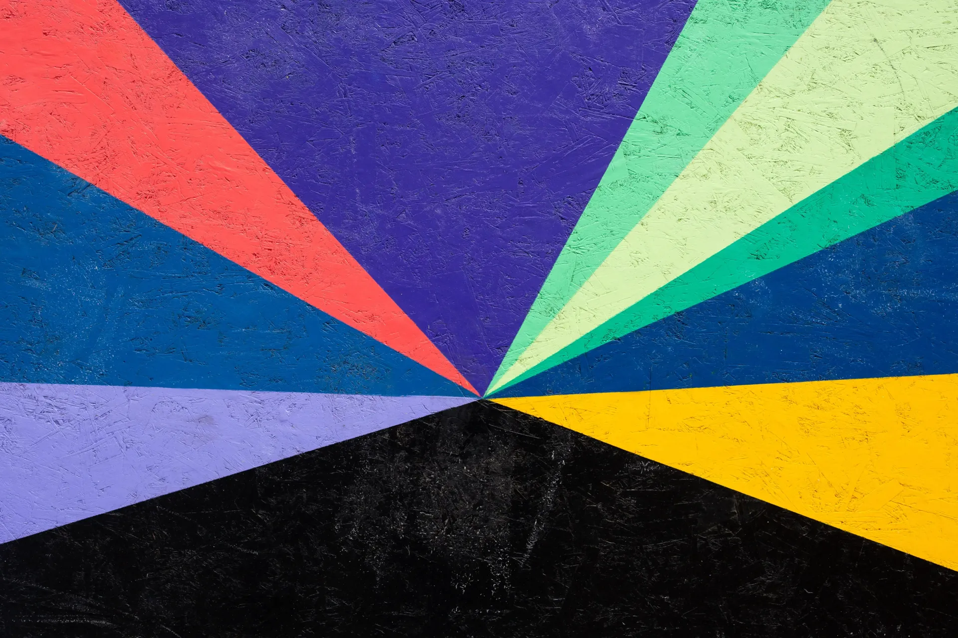 A close up of a colorful painting on a wall.