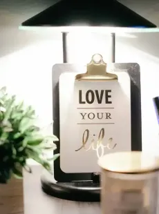 A clipboard with the words `` love your life '' on it