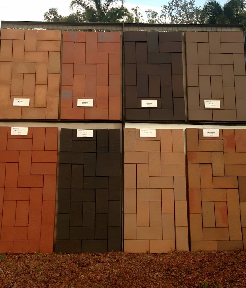 Four Different Colored Bricks Are Stacked On Top Of Each Other — S & K Raw Materials & Earthmoving in Atherton, QLD