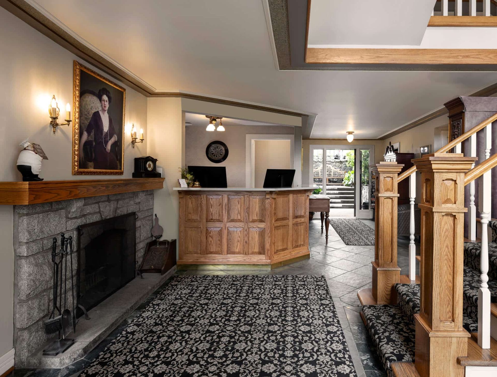 Abigail's Hotel lobby with a fireplace and stairs