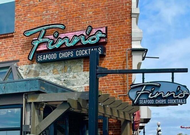 Finn 's seafood chops cocktails is a restaurant located in a brick building.