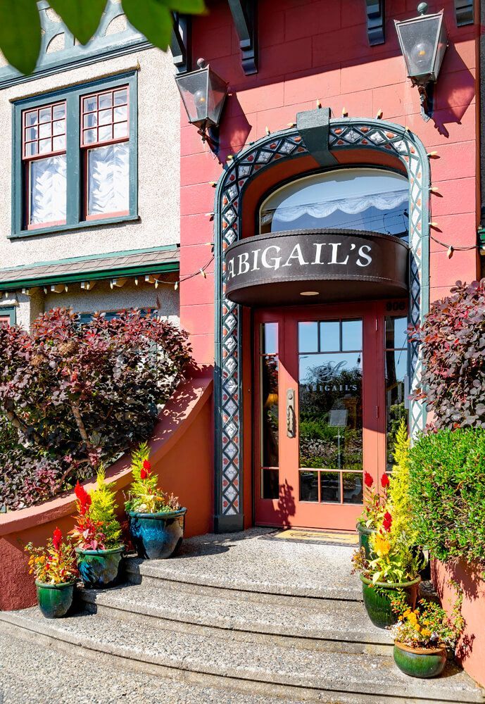 A red building with a sign that says Abigail's on it