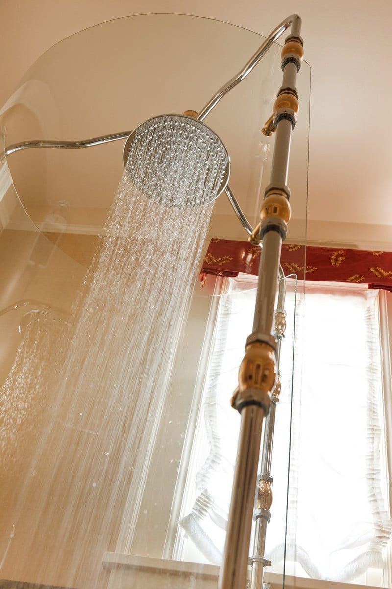 A shower head with water coming out of it