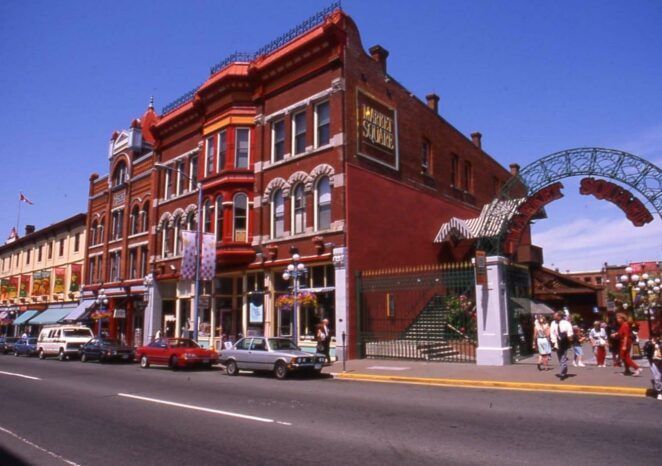 A red brick building with a sign that says ' hotel ' on it