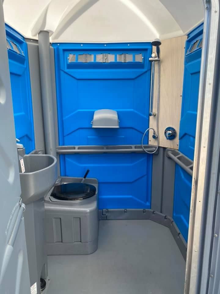 A Portable Toilet With a Door and a Sink — Absoloo Hire Pty Ltd in Wyong, NSW