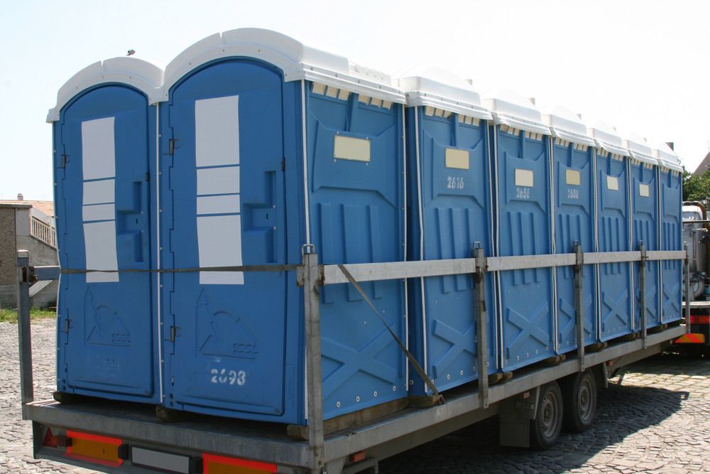 A Row of Portable Toilets on a Trailer — Absoloo Hire Pty Ltd in Hunter Valley, NSW
