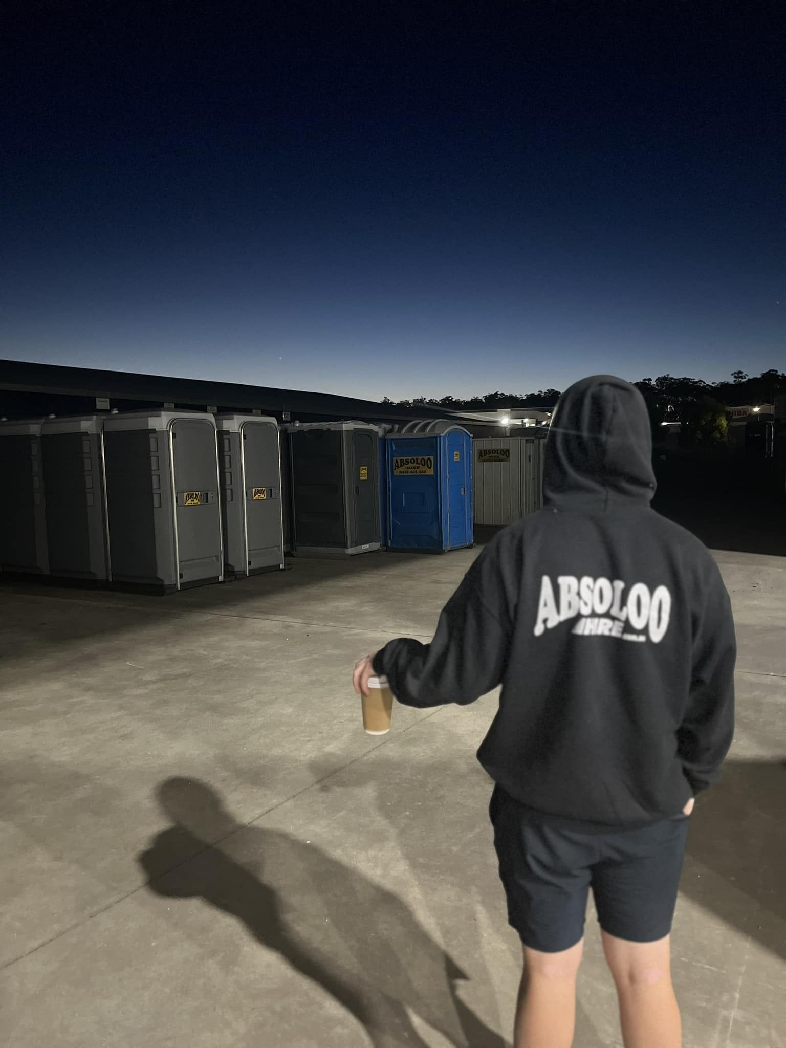 A Row of Portable Toilet is Parked in a Parking Lot — Absoloo Hire Pty Ltd in Hunter Valley, NSW