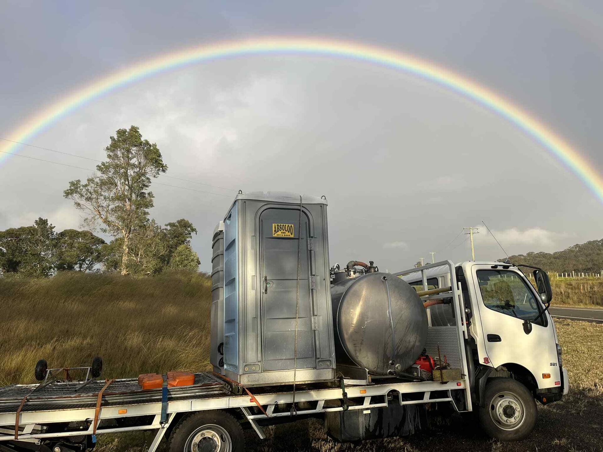 A Truck With a Portable Toilet on the Back is Parked — Absoloo Hire Pty Ltd in Hunter Valley, NSW
