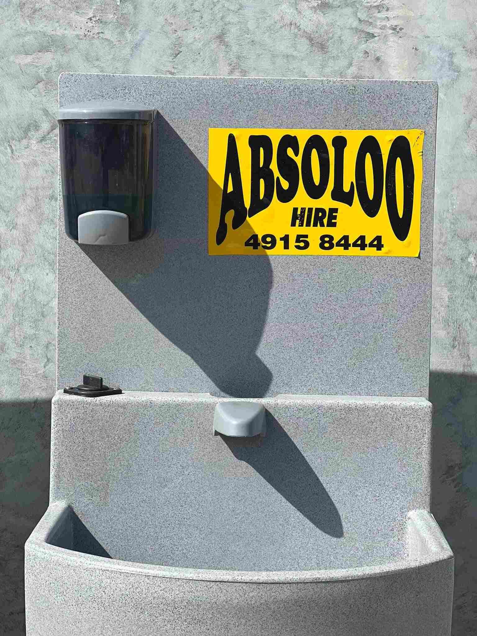 A Stainless Steel Sink With Two Sinks and a Faucet — Absoloo Hire Pty Ltd in Newcastle, NSW