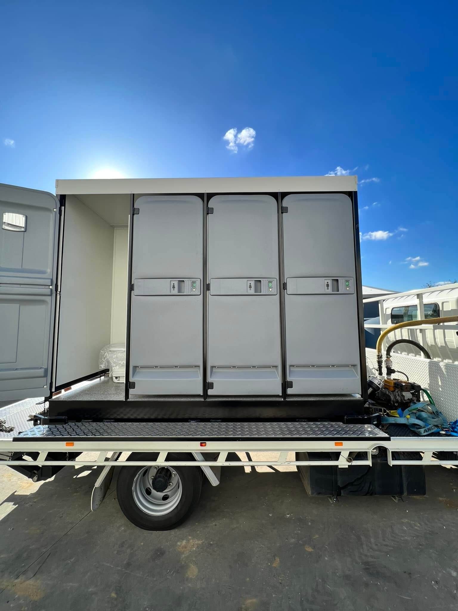A Truck With a Toilet on the Back is Parked — Absoloo Hire Pty Ltd in Forster, NSW