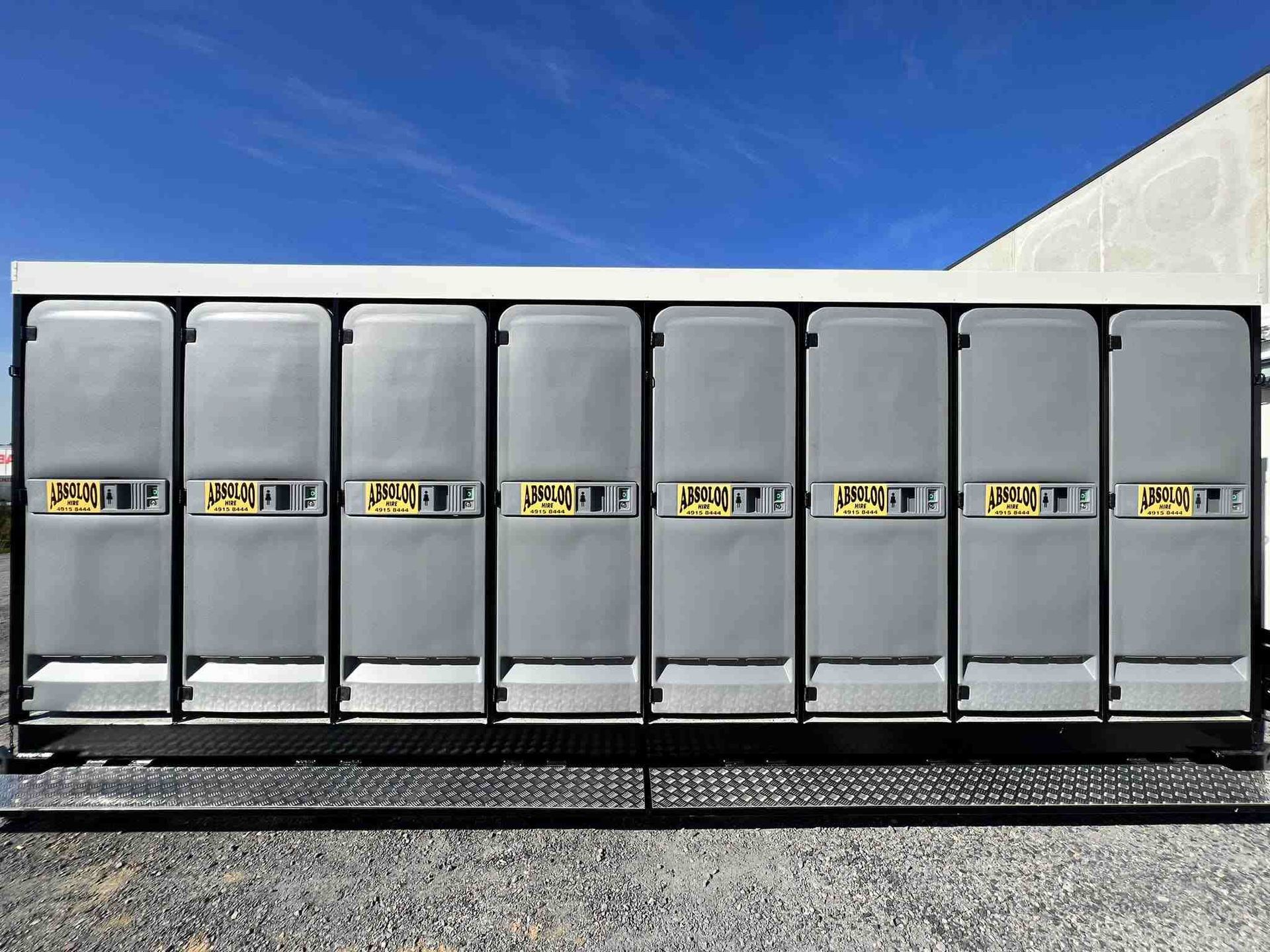 A Row of  Portable Toilet — Absoloo Hire Pty Ltd in Coffs Harbour, NSW
