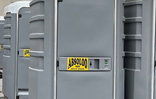 A Row of Portable Toilets — Absoloo Hire Pty Ltd in Newcastle, NSW