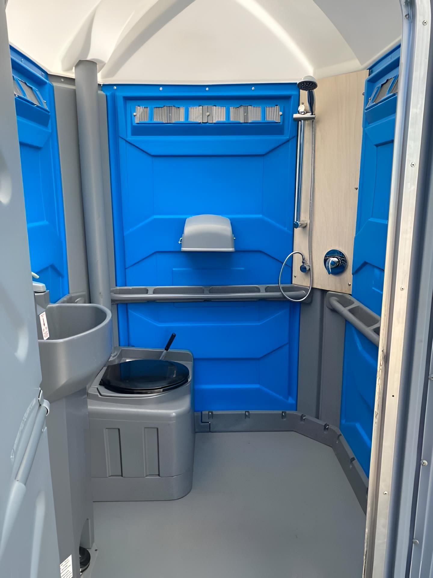 A Blue Portable Toilet With a Sink and a Shower — Absoloo Hire Pty Ltd In Morisset, NSW