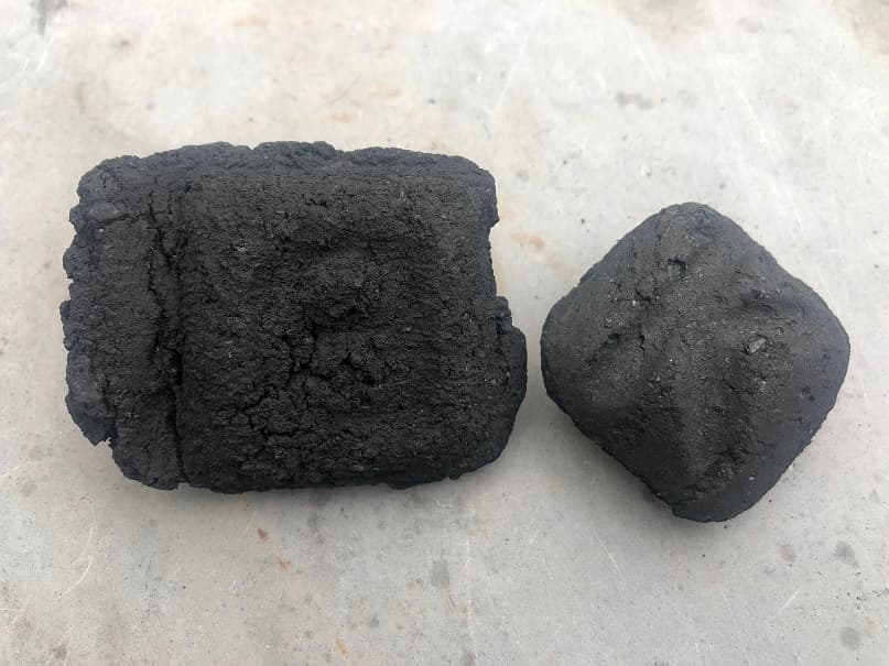 Credit: Extraordinary BBQ Opened bag of B&B Competition Oak Charcoal Briquets leaning against a weber grill