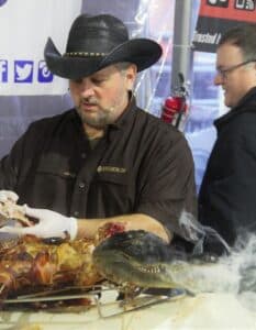 Source: Vic Clevenger Vic Clevenger serving barbecued alligator