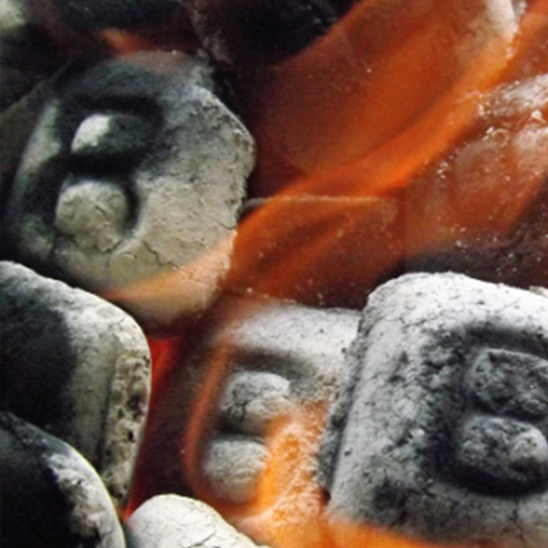 closeup of B&B Competition Briquets burning from B&B charcoal company